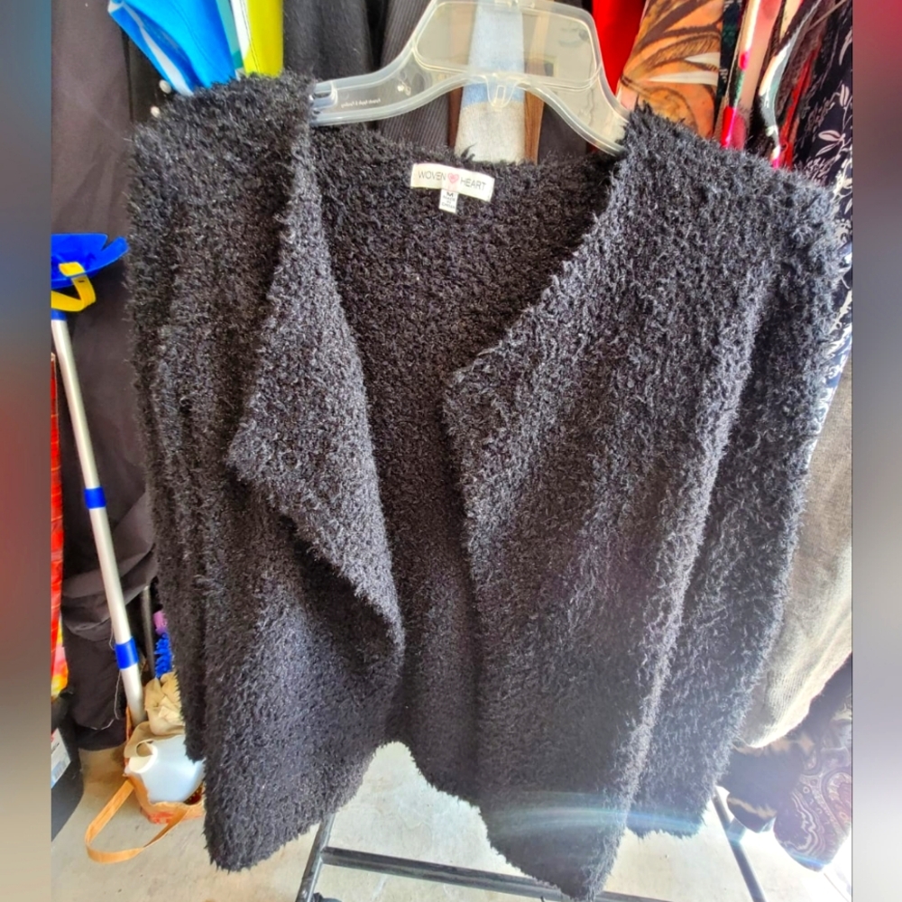 Black sweater size M, button less, good condition